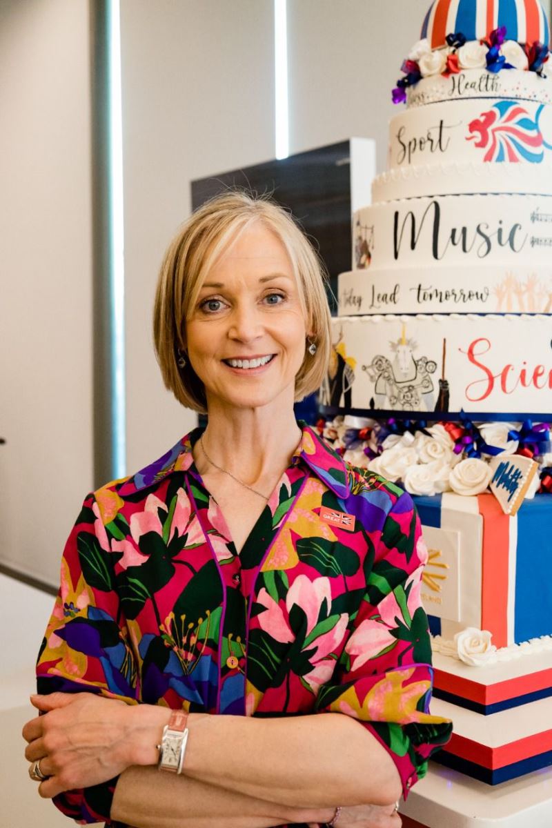 Mich Turner with UK National Day Cake at Expo 2020 Uk Pavilion